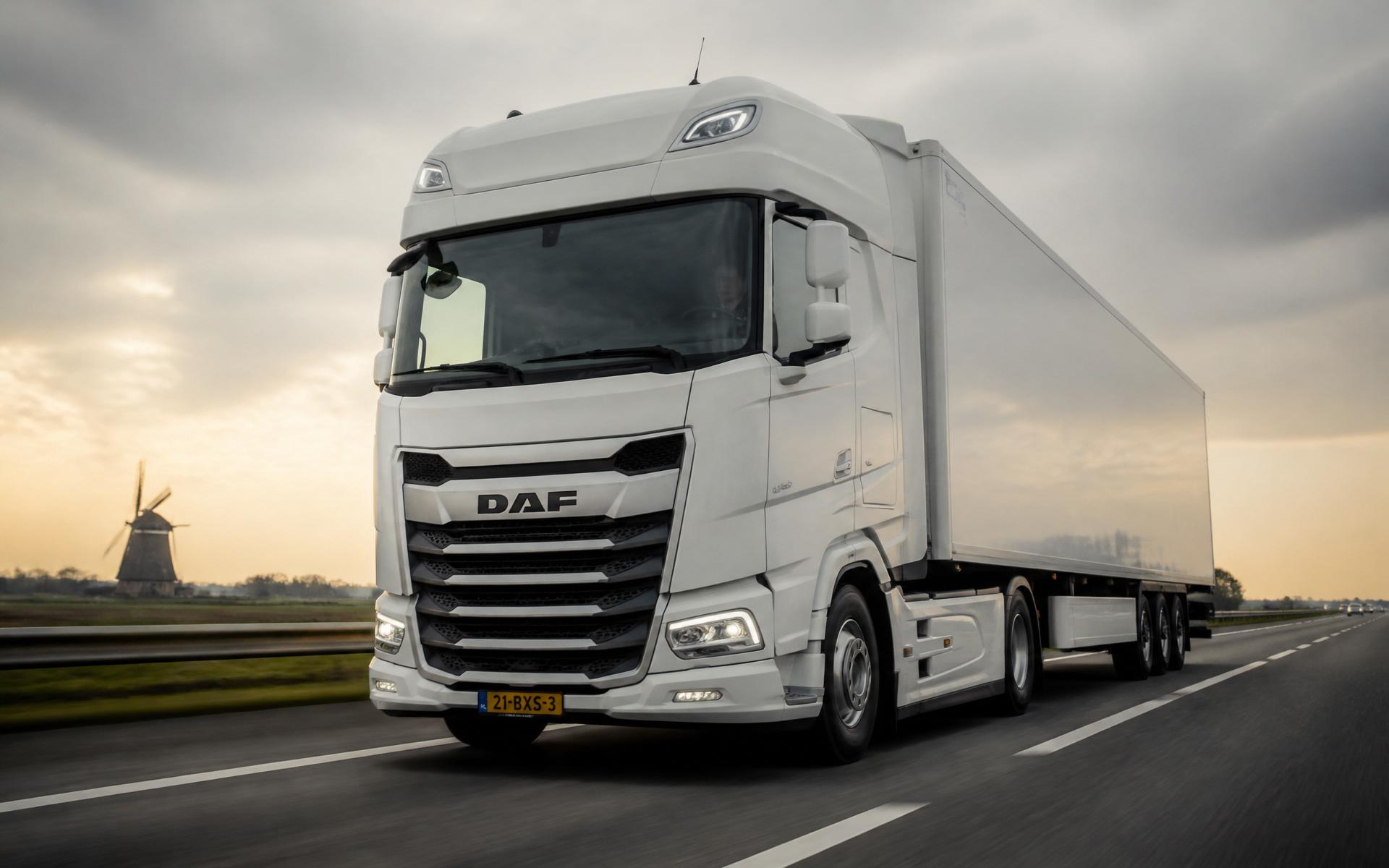 Modern European truck on a highway at dusk